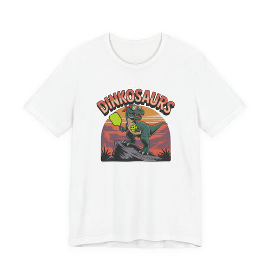 Dinkosaurs T‑Shirt — Retro Dino Holding Pickleball Paddle Graphic Tee
