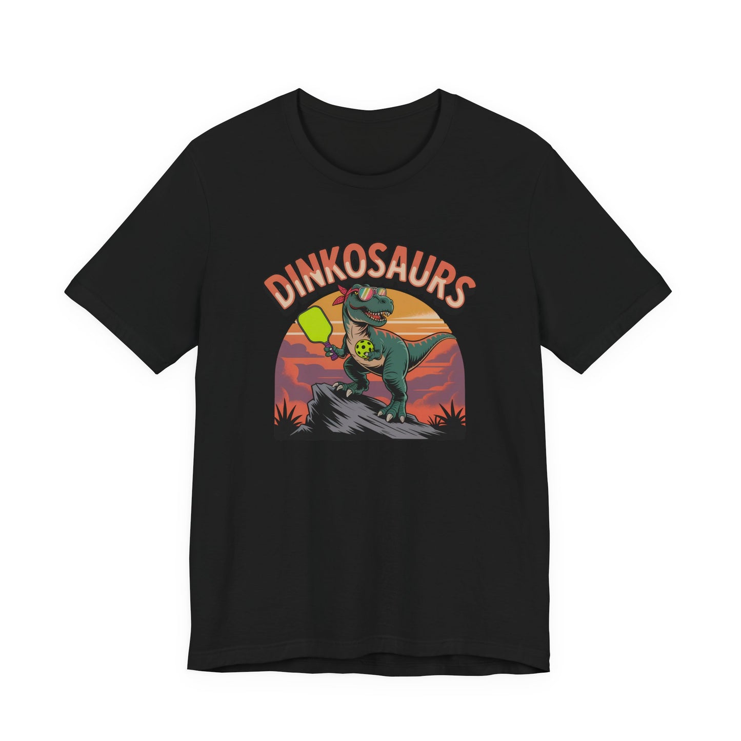 Dinkosaurs T‑Shirt — Retro Dino Holding Pickleball Paddle Graphic Tee